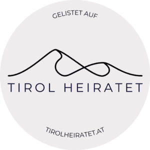 Logo von Tirol heiratet mit Bergmotiv und Website-URL